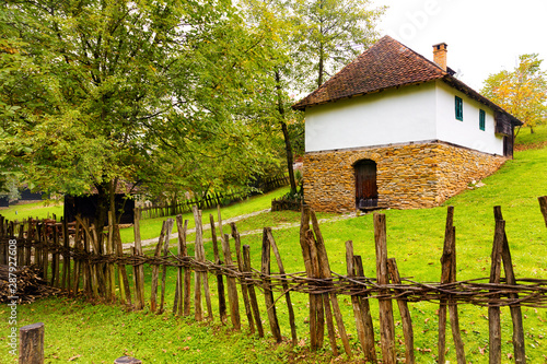Medieval stone and wood peasant house, deep inside the forest.