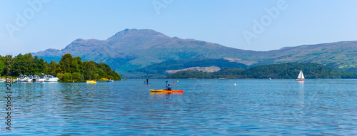 Luss at Loch Lomond, Scotland, 25 August 2019. People relaxing and having fun during one of the hot days in Summer.
