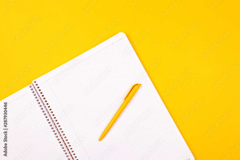 2020 PLAN. White notebook on a yellow background, yellow pen, goals for the year. 2020 PLAN. White notebook on a yellow background, yellow pen, goals for the year.