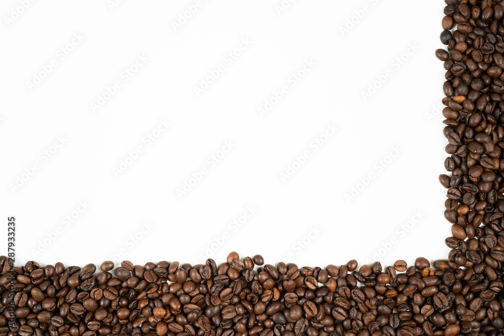 Fototapeta premium Coffee beans frame with beans at the bottom and right side on a white background