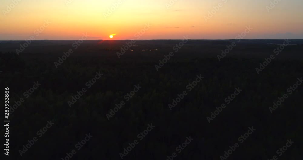 Swamp at sunset, Aerial, rising, drone shot over forest, towards reflecting wet, water spots, at a finnish bog, at dusk, on a sunny, autumn evening, in Torronsuo national park,, Kanta-hame, Finland Swamp at sunset, Aerial, rising, drone shot over forest, towards reflecting wet, water spots, at a finnish bog, at dusk, on a sunny, autumn evening, in Torronsuo national park,, Kanta-hame, Finland