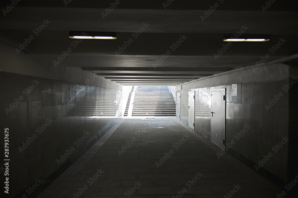 The underground passage lined with gray granite and marble