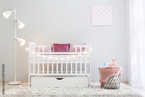 Fototapeta Naklejka Na Ścianę i Meble -  Interior of light modern baby room with crib