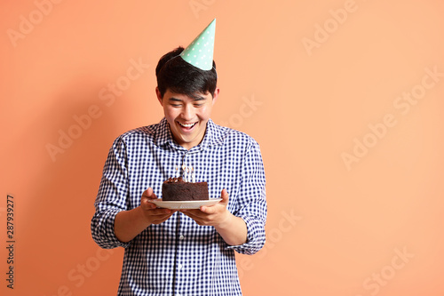Happy man with Birthday cak...