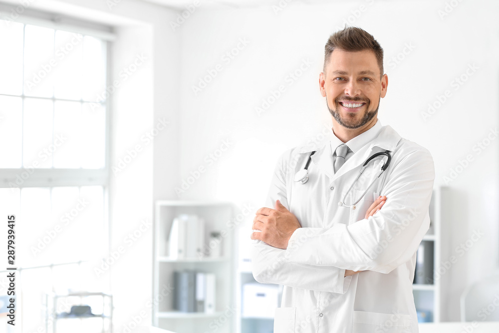 Male doctor with stethoscope in clinic