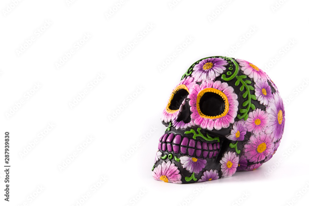 Typical Mexican skull painted isolated on white background.Copyspace. Dia de los muertos. Typical Mexican skull painted isolated on white background.Copyspace. Dia de los muertos.