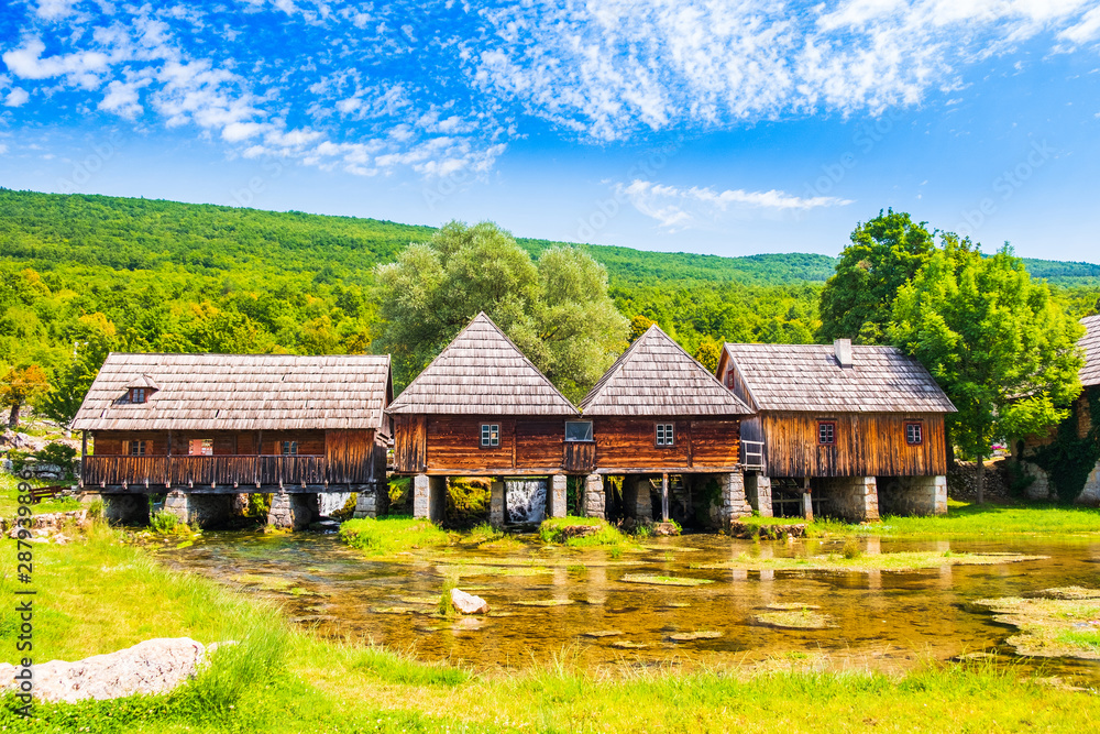 Croatia, countryside region of Lika, Majerovo vrilo river source of Gacka, traditional village with old wooden mills and cottages Croatia, countryside region of Lika, Majerovo vrilo river source of Gacka, traditional village with old wooden mills and cottages