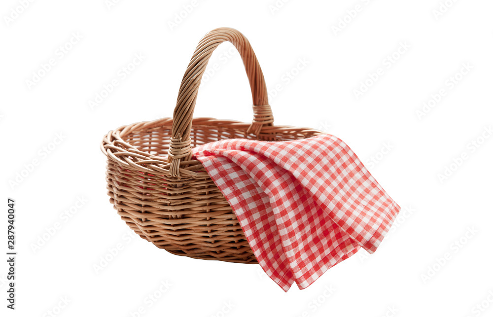 Red napkin and picnic basket isolated on white. Red napkin and picnic basket isolated on white.