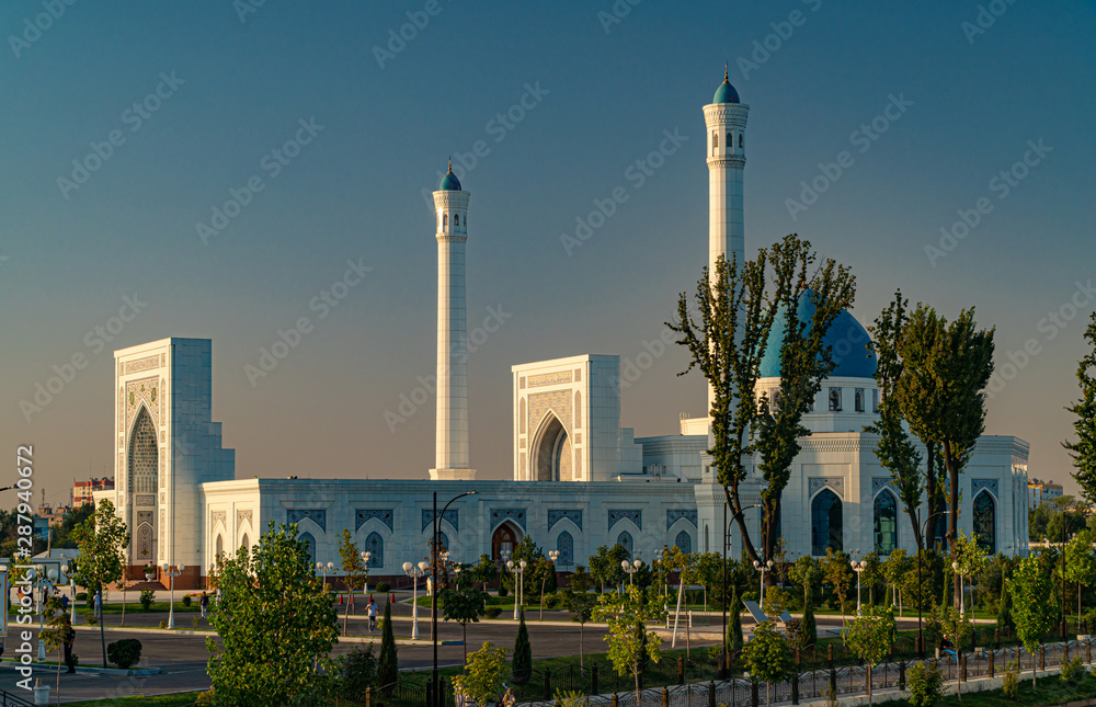 A big beautiful Mosque (Islamic temple) at sunrise over blue sky