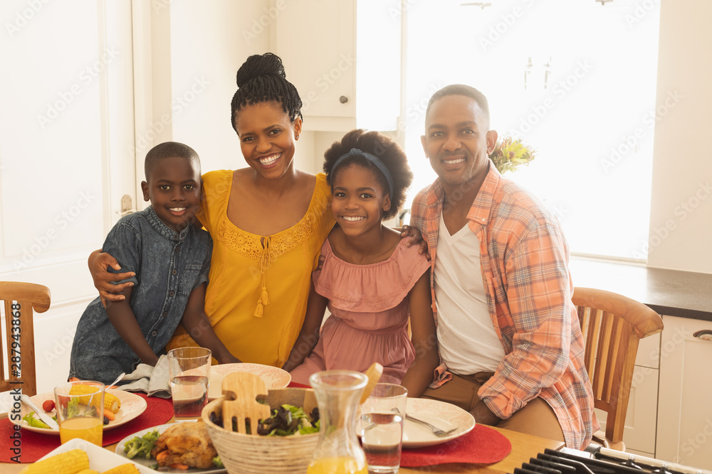 Happy African American family looking at camera