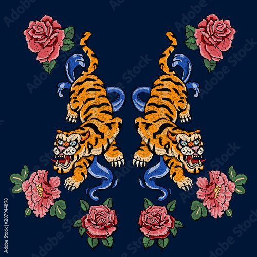 Embroidery patch with oriental tigers and flowers. Vector embroidered floral motif