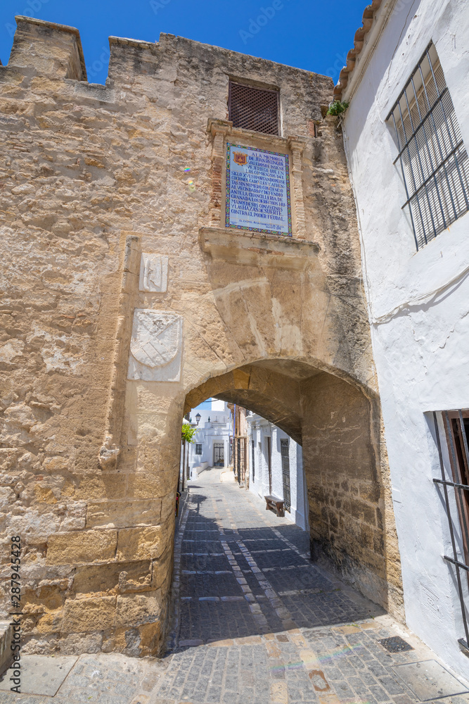 ancient Segur Gate, from XV century, in public street of typical Andalusian village named Vejer de la Frontera (Cadiz, Andalusia, Spain, Europe)