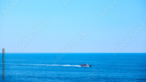 Sea with motorboat © Roman Sigaev