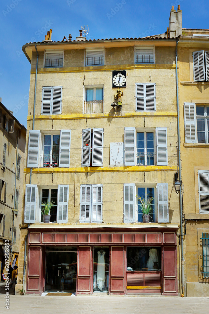  facade of mediterranean building with white shutter 