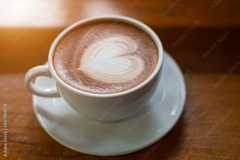 Hot Coffee Late Art on Wood Table in Coffee Shop Hot Coffee Late Art on Wood Table in Coffee Shop