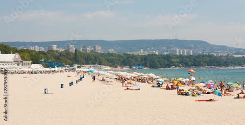VARNA, BULGARIA - AUGUST 14, 2015: people rest on city beach. © Iva