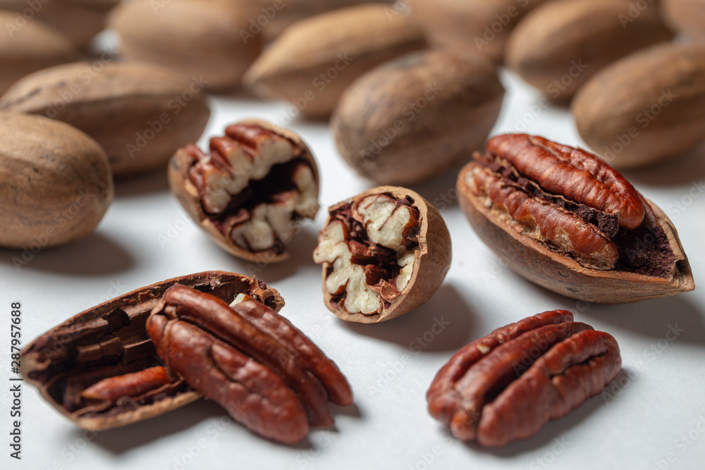 Group of pecan nuts on the white background Group of pecan nuts on the white background