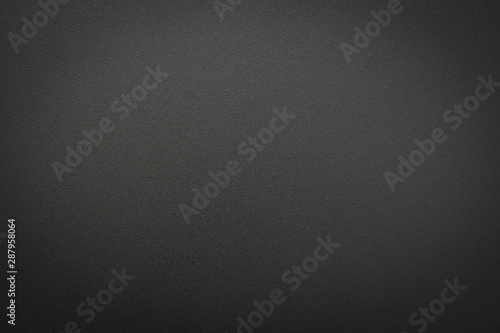 Close-up of black gray metal texture. Surface of rough abstract dark black matte background. Design in your work backdrop, concept copy space for text. photo