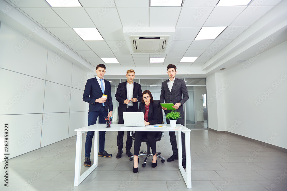 Group of young business people at office. Group of young business people at office.