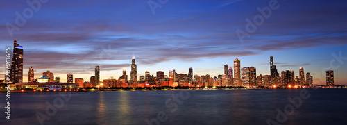 Panoramic view of Chicago skyline at dusk with Lake Michigan on the foreground, IL, USA © vlad_g