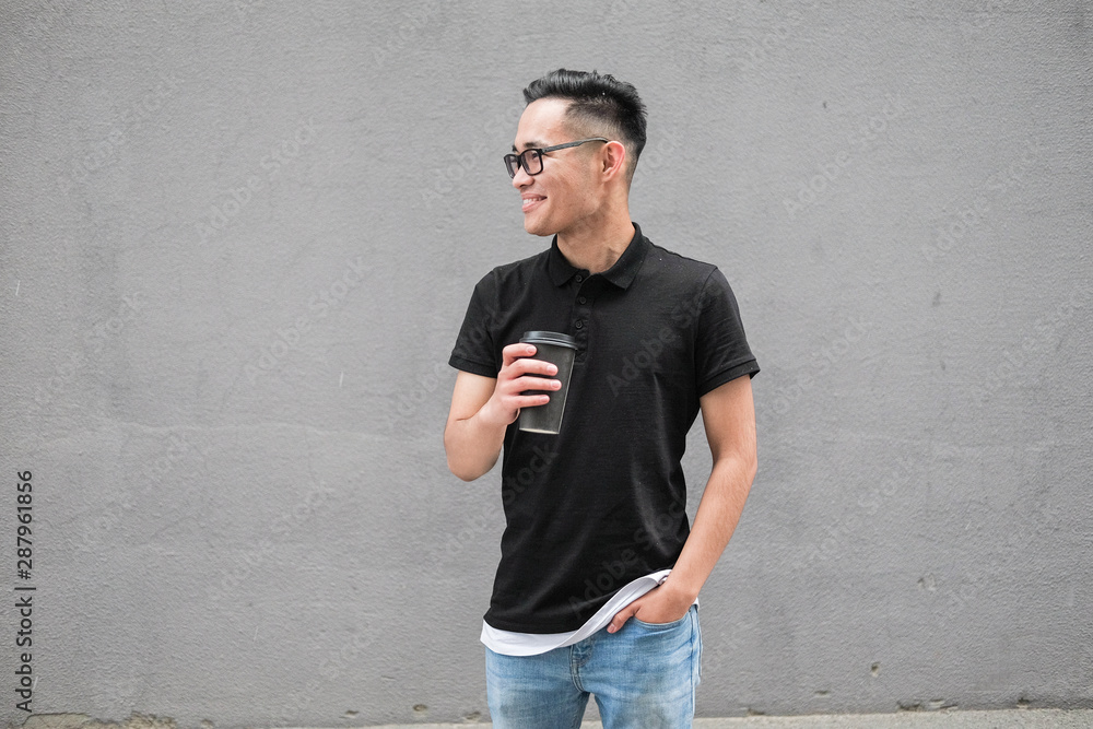 Korean man in a black t-shirt. Asian man with glasses. Korean man in a black t-shirt. Asian man with glasses.