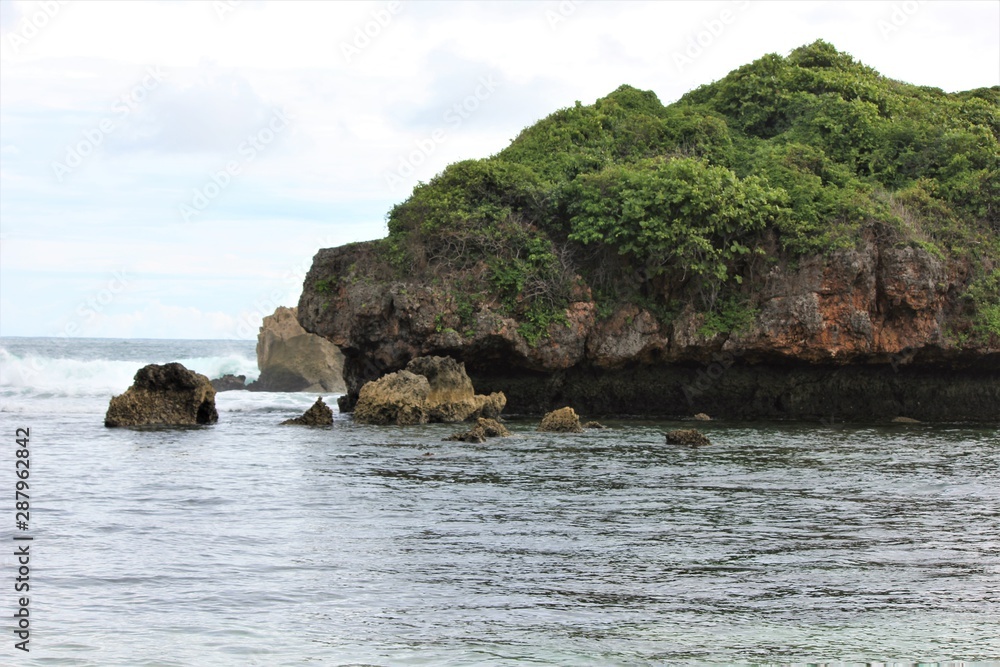 beautiful cliff in the sea, pantai seruni indonesia