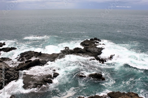 waves crashing on the rocks , seruni indonesia