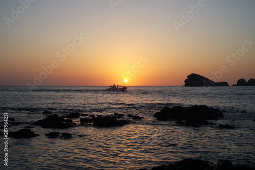 A Boat on Sunset