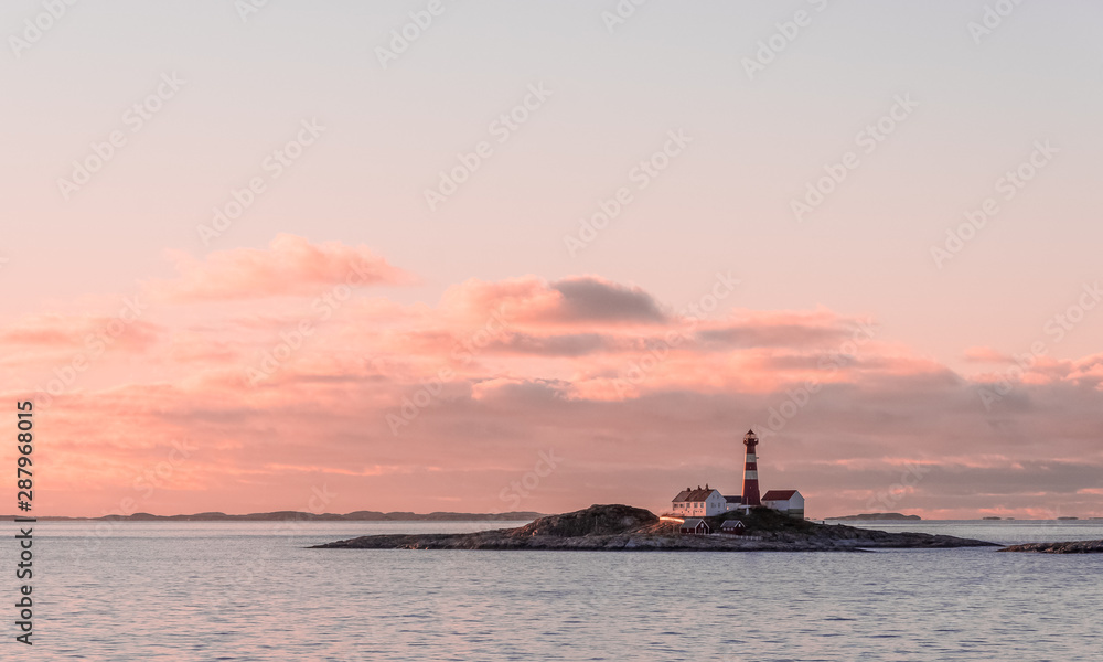 Landegode Lighthouse on the coast of Norway seen from the Hurtigruten ship MS Richard With Landegode Lighthouse on the coast of Norway seen from the Hurtigruten ship MS Richard With