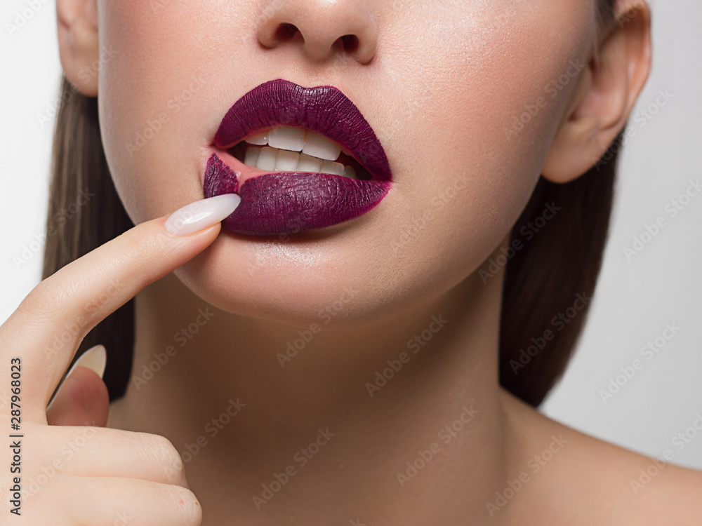 Beautiful girl in mask with long nails and sensual lips. Beauty Stock Photo  | Adobe Stock