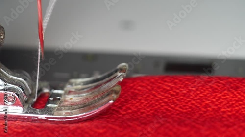 Modern sewing machine works slow motion macro shot photo