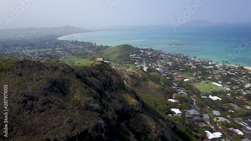 Aerial Fly Over Of Hiking Trail Above Tropical Blue Ocean photo