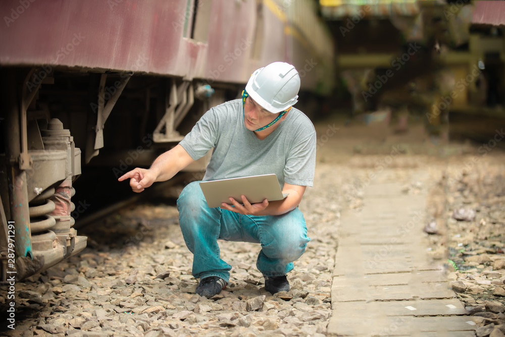 enginee man checking train before service enginee man checking train before service