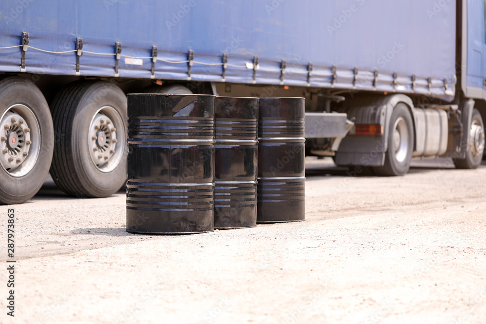 Black oil Barrels on a Truck Background