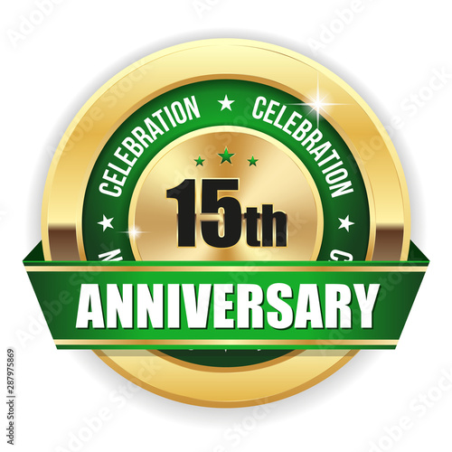 Gold 15th anniversary badge with green ribbon on white background
