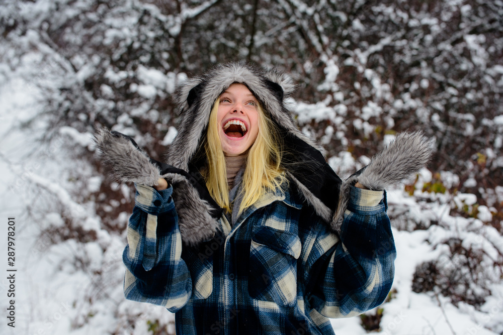 Winter holidays. Beautiful woman in warm coat, fur hat and mittens. Cold winter weather. Christmas girl in warm clothing in winter park. Fashion girl in wintertime. Happy girl playing snow winter day. Winter holidays. Beautiful woman in warm coat, fur hat and mittens. Cold winter weather. Christmas girl in warm clothing in winter park. Fashion girl in wintertime. Happy girl playing snow winter day.