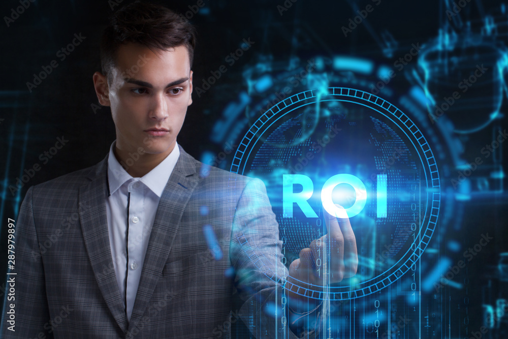 The concept of business, technology, the Internet and the network. A young entrepreneur working on a virtual screen of the future and sees the inscription: ROI The concept of business, technology, the Internet and the network. A young entrepreneur working on a virtual screen of the future and sees the inscription: ROI