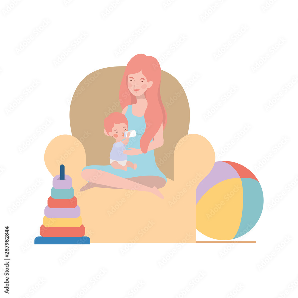 cute pregnancy mother with little boy seated in sofa cute pregnancy mother with little boy seated in sofa