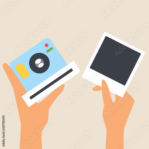 Blue camera for snapshots in hand. The other hand holds a snapshot. Snapshot frame. Photo card appears. Lens. Gadget for photos. Flat style. Editable vector illustration