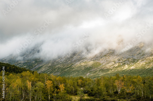 Beautiful view of the Khibiny Mountains in the fog in summer