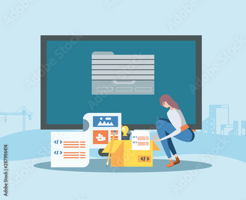 builders and desktop with webpage under cosntruction