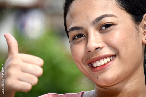 Young Diverse Woman With Thumbs Up