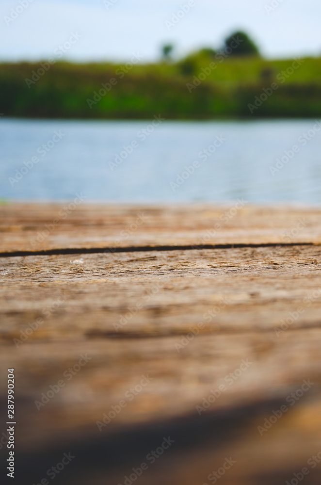 Abstract blurred background of wooden bridge and water Abstract blurred background of wooden bridge and water