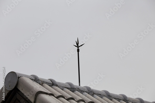Obraz na plátně Lightning rod on the roof of a building for lightning protection systems