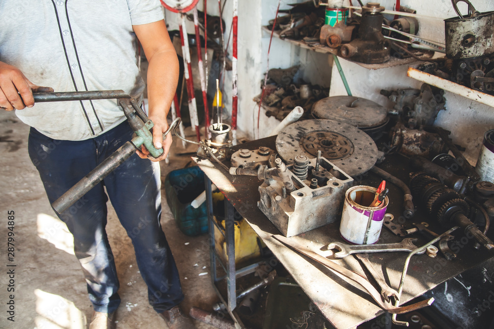 Obraz premium man hand car different tools