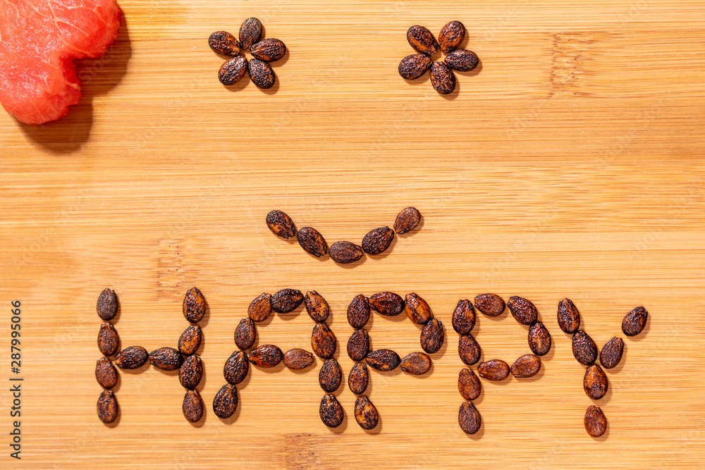 Happy word made of seeds and smiley face Happy word made of seeds and smiley face