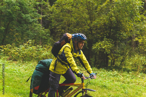 bicycle tourist in the autumn forest