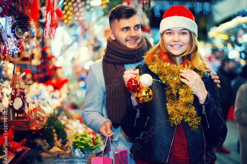 Couple in Christmas hat happinnes from buying decoration photo