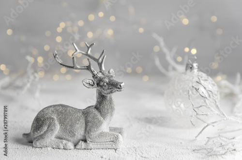 Christmas. New Year's eve composition silver deer and white New Year's ball