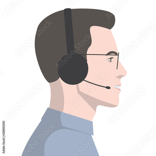 Side view of a face of a handsome man talking on the phone in the office